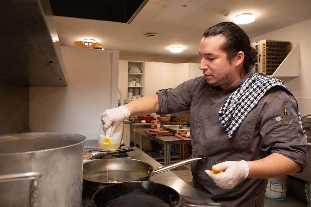 Chef cooking at Red Bank Lodge – Photo: Red Bank Lodge