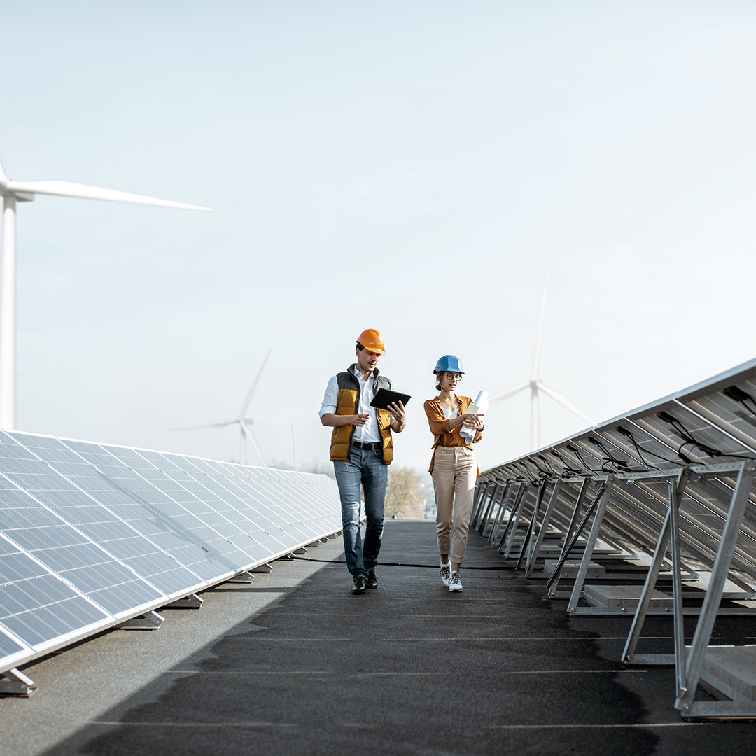 Solar technicians walking through solar field