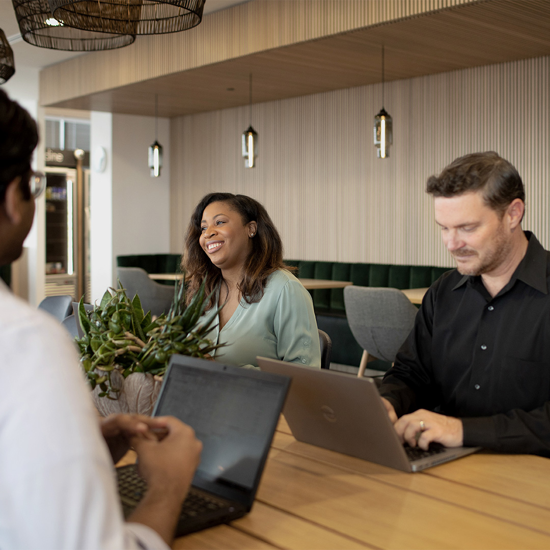 People sitting around the table working.