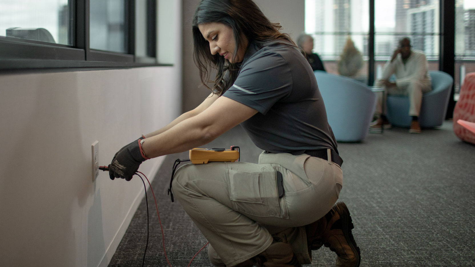 A person plugging in a cord