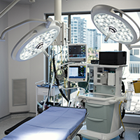 Empty, well-equipped surgical room with medical devices.