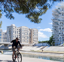 cyclist riding through city