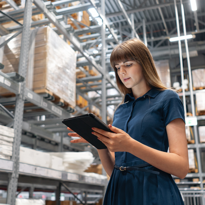 a warehouse supervisor reviews logistics checklist