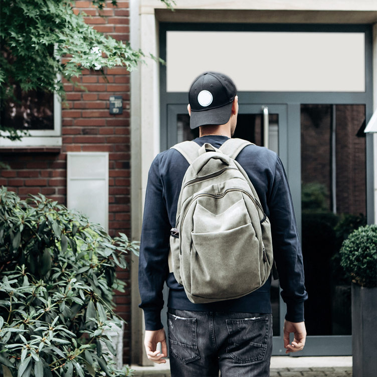 student walking to his dorm