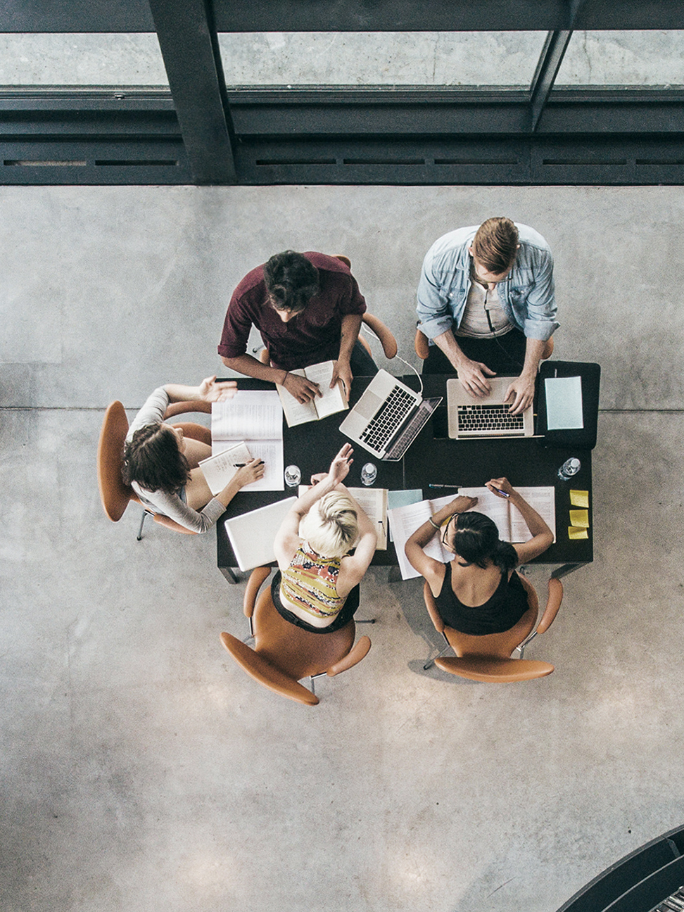 A group of professionals collaborating around an office table