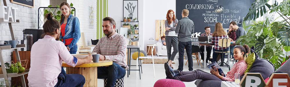 Modern and vibrant coworking space showcasing flexible work areas and a collaborative atmosphere.
