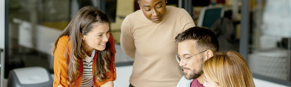 Team of real estate professionals collaborating in a meeting together.