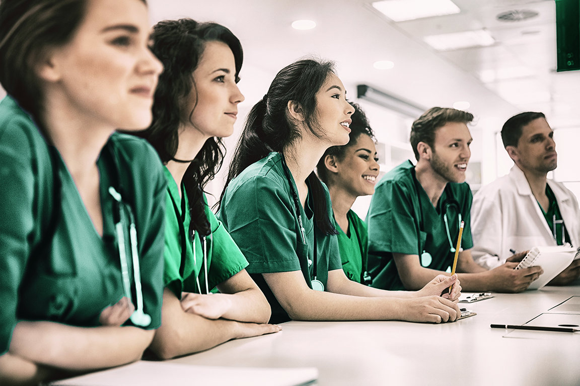 A group of healthcare workers in scrubs