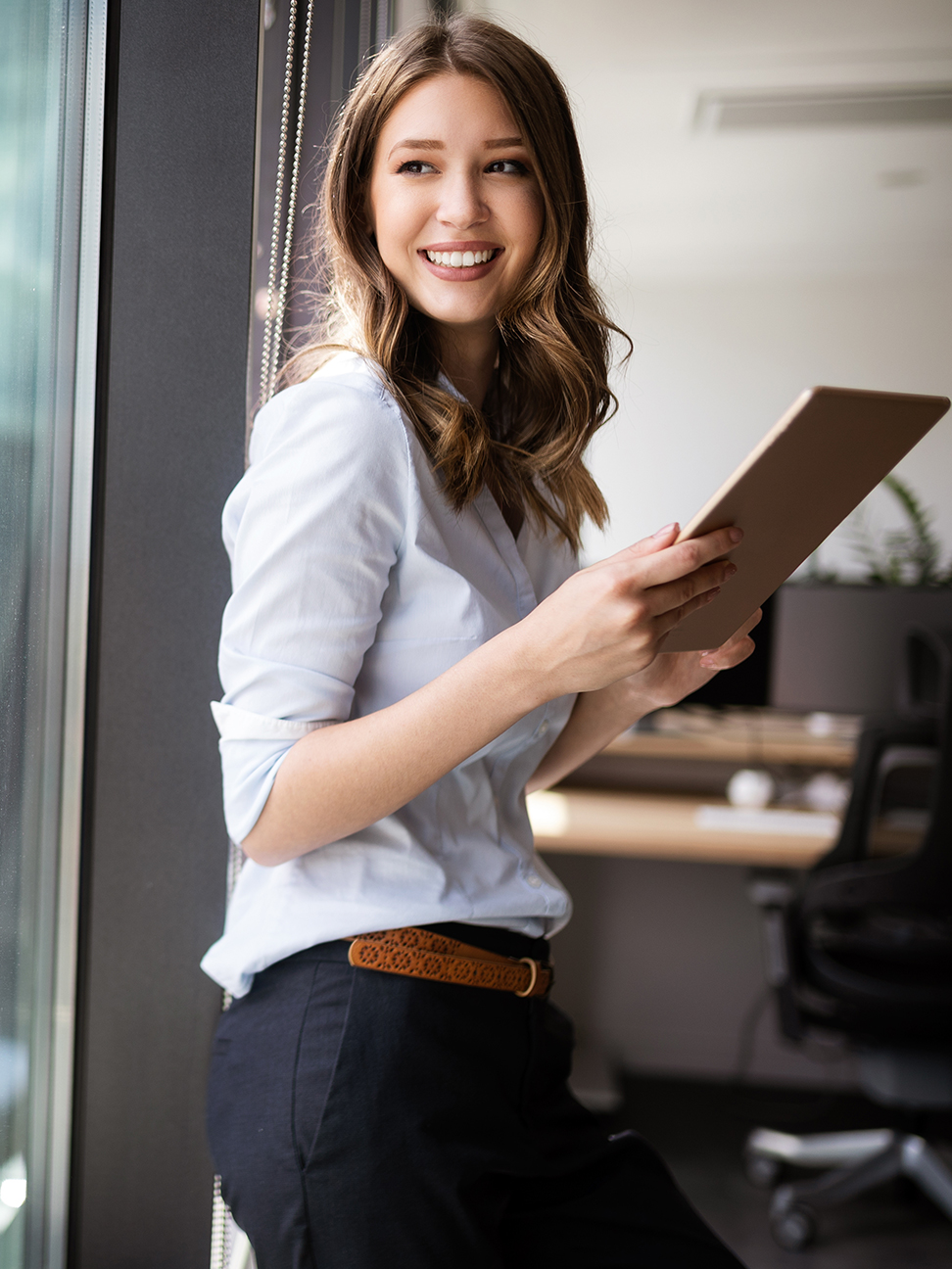 woman using a tablet in an office