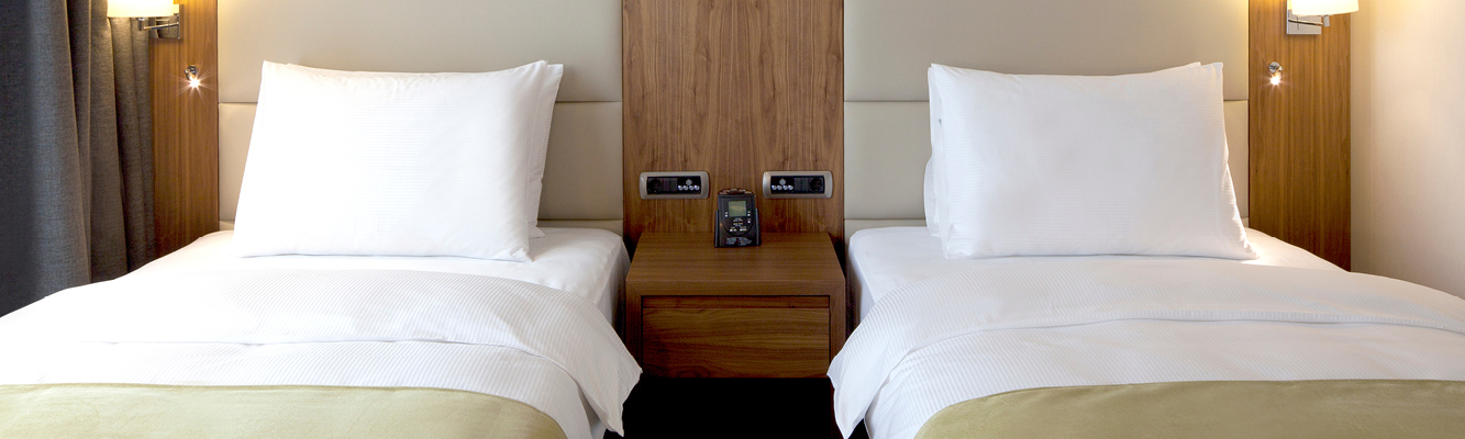 Image of a hotel room with beds