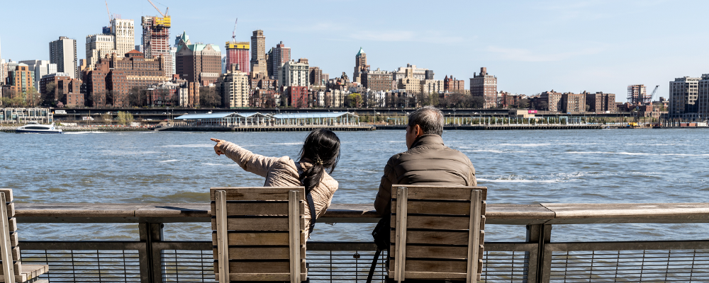 Image of people sitting in chairs on a dock