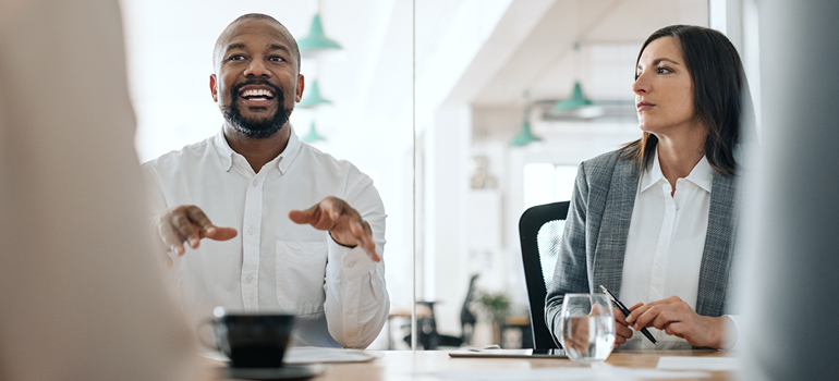 Image of people in office meeting