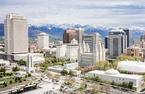 Aerial view of city in front of mountains