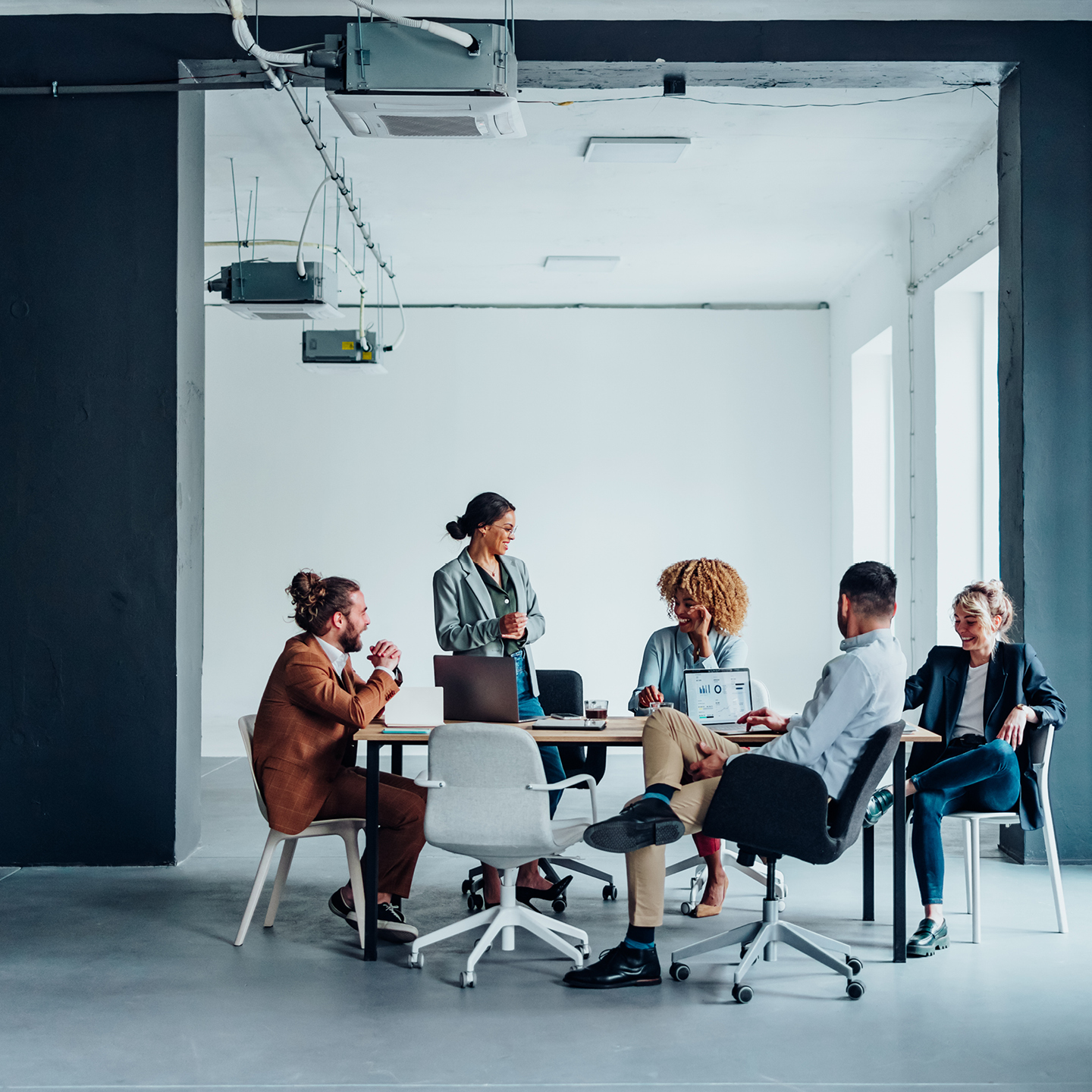 Employees sitting around table