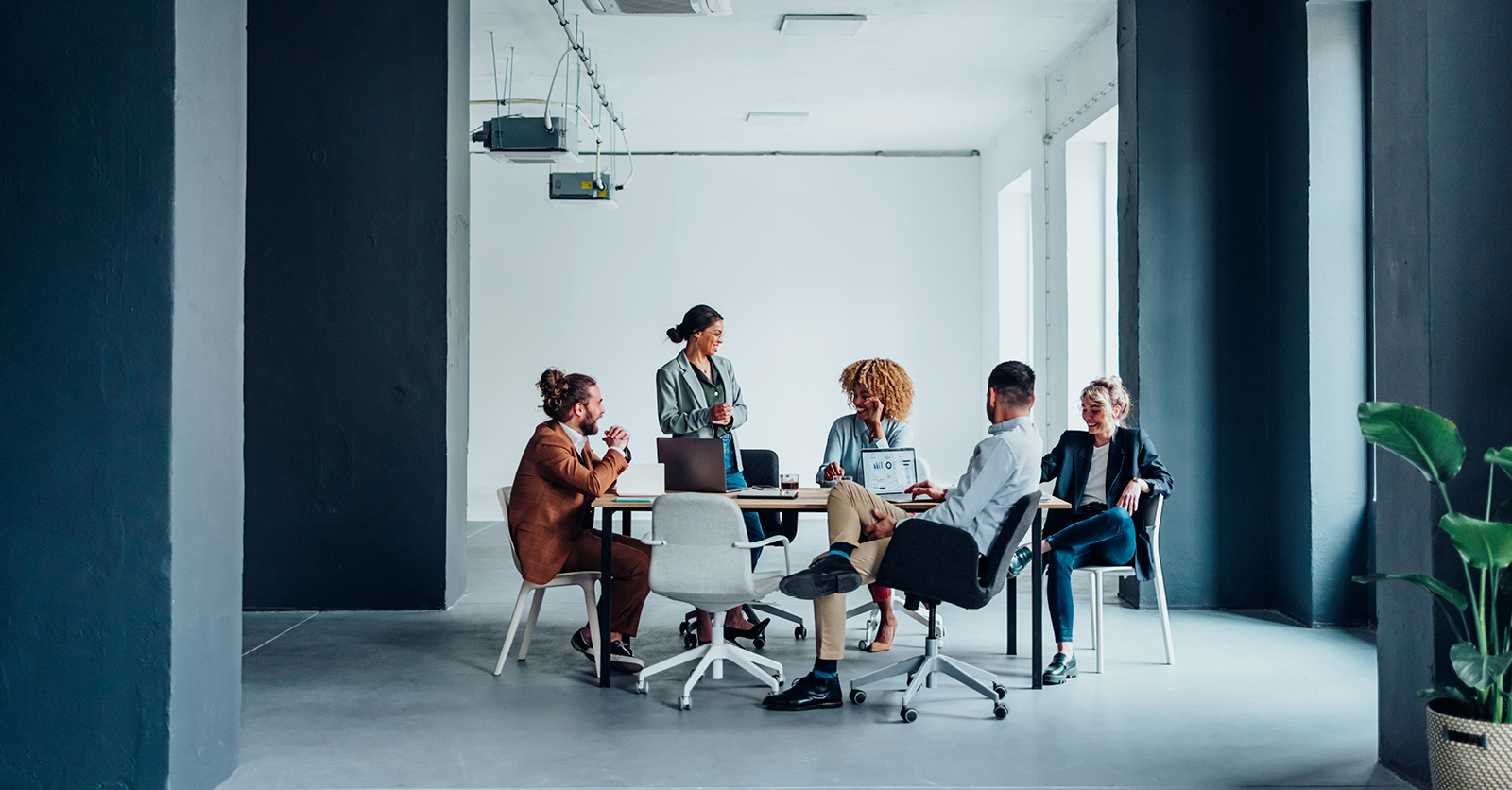Employees sitting around table