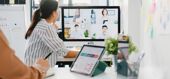 employees meet over video conference