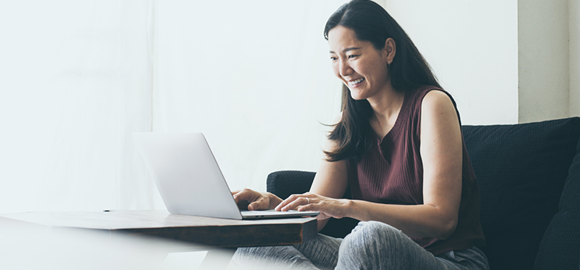 woman works on a laptop at home