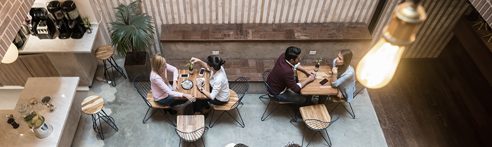 Image of people working at tables