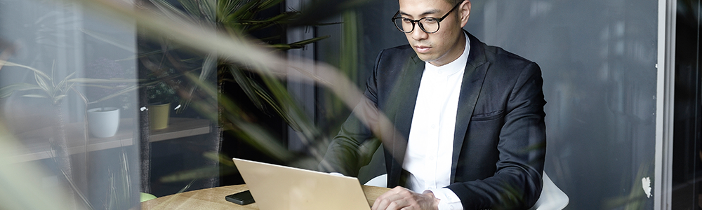 Image of man at a laptop