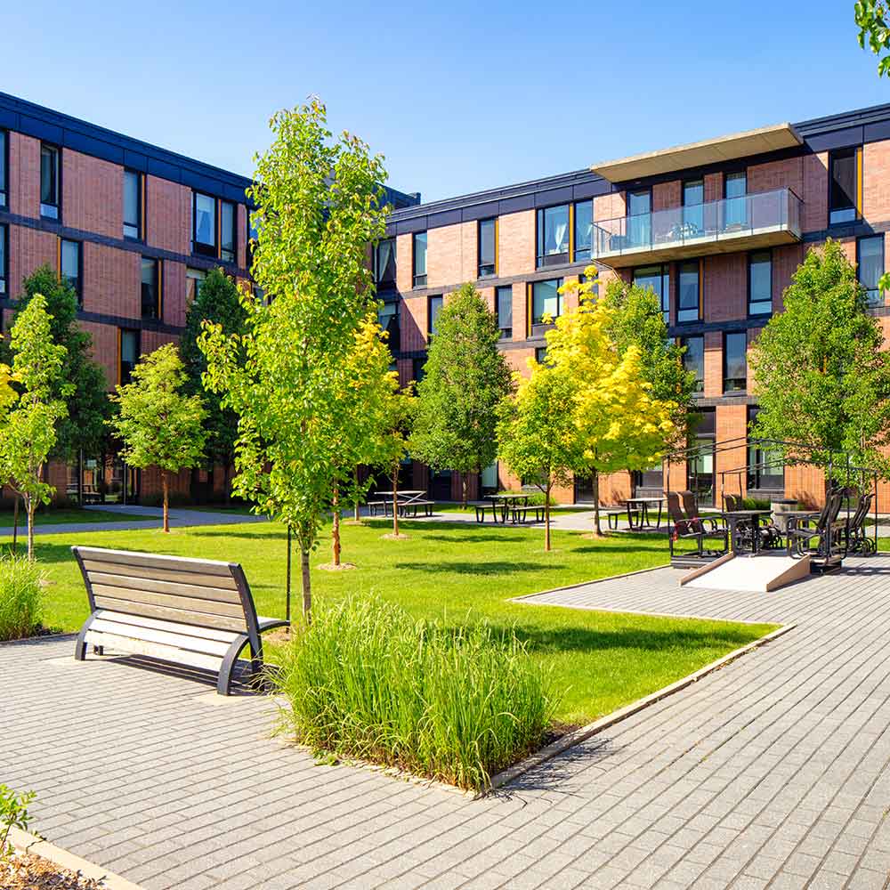 Apartment complex with a green garden