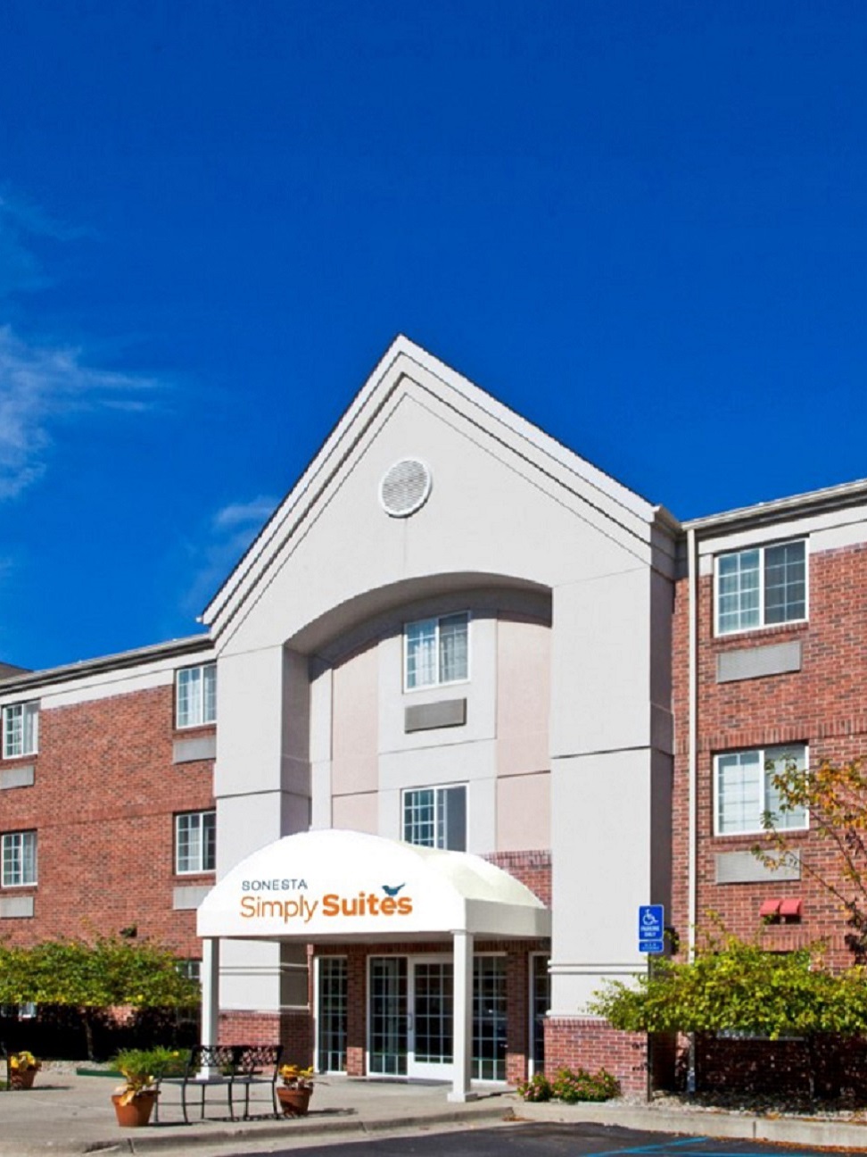 Exterior of a Simply Suites hotel entrance