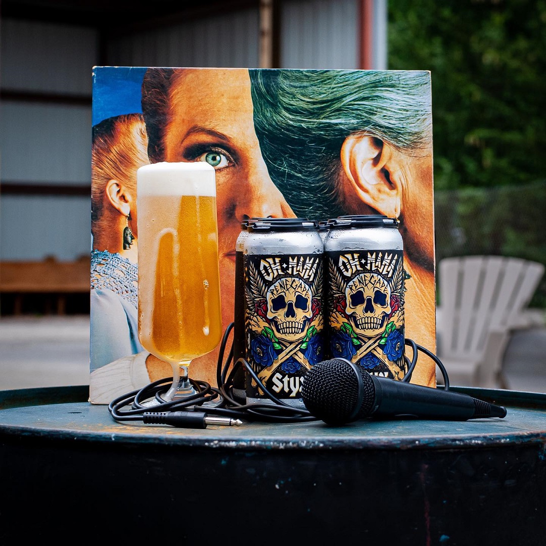 Cans of Voodoo Brewing's Renegade beer with a microphone wrapped around the cans