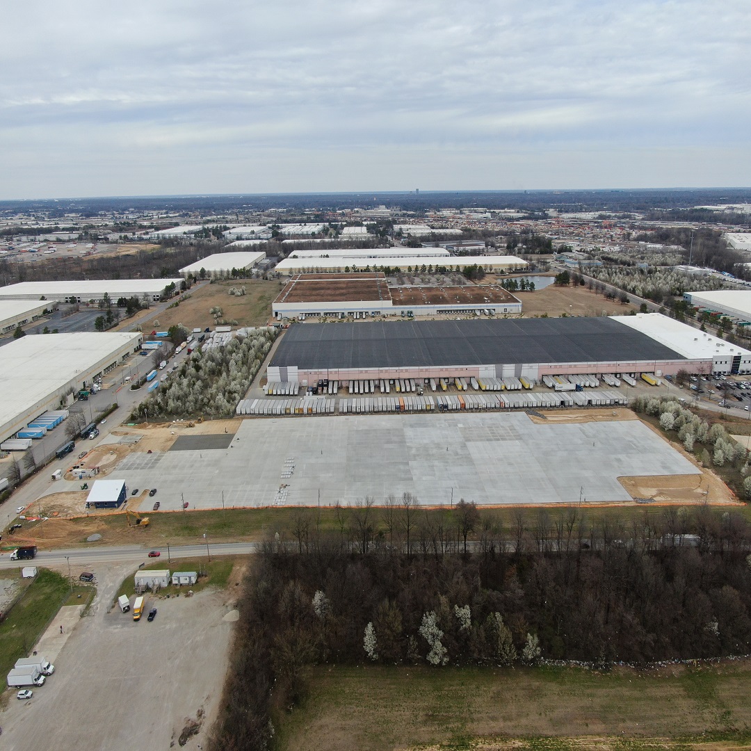 aerial view of concrete slab and industrial building
