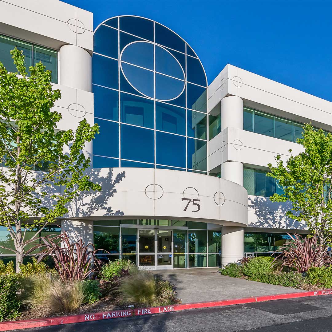 Exterior of medical office building with arch glass windows.