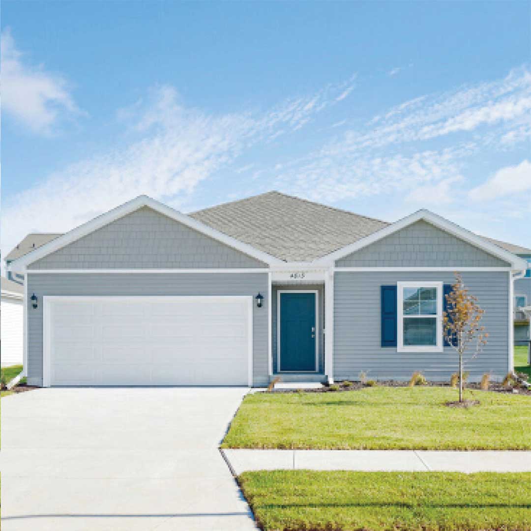 A light blue townhouse on a sunny day