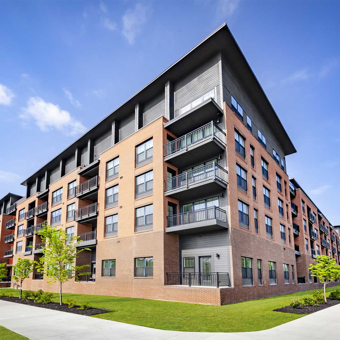 A tan apartment building