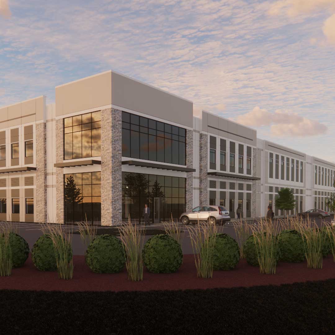 A large industrial building at sunset