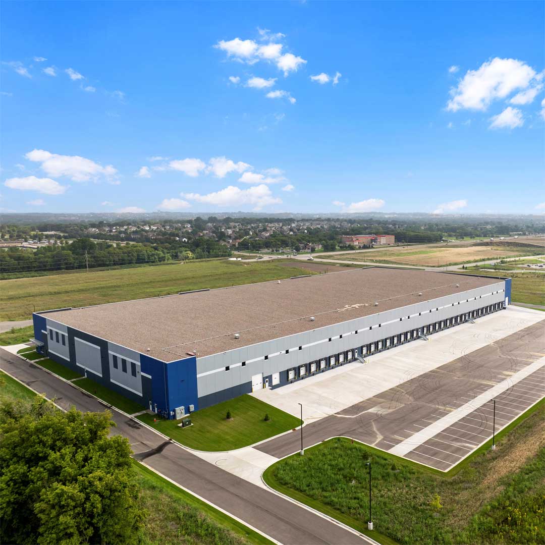 A large industrial building on a sunny day.
