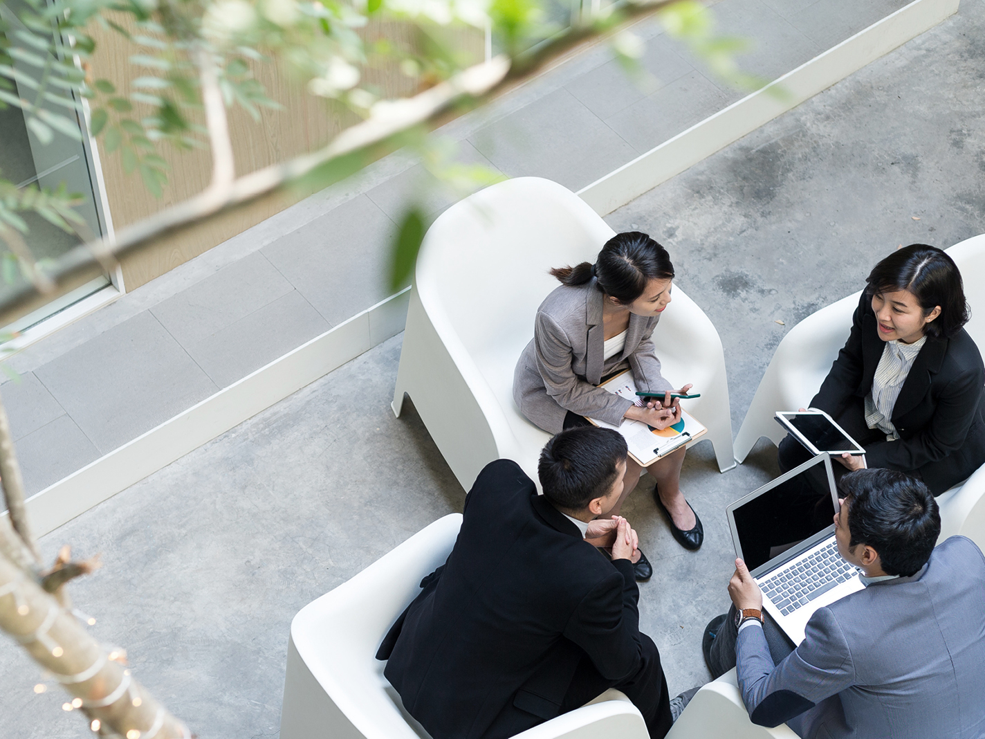 employees meeting in outdoor patio space